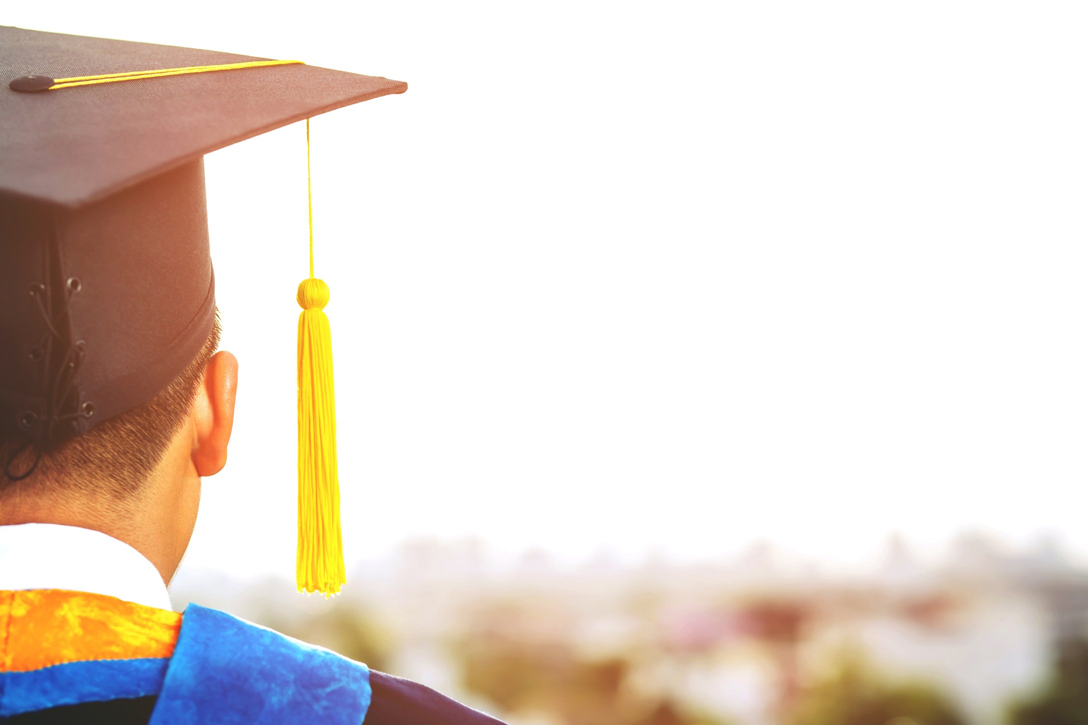 Student Wearing His Graduation Cap and Gown